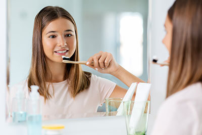 Girl brushing her teeth