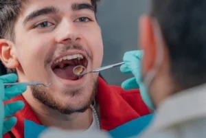 dentist checking a patient's mouth dentist checking a patient's mouth