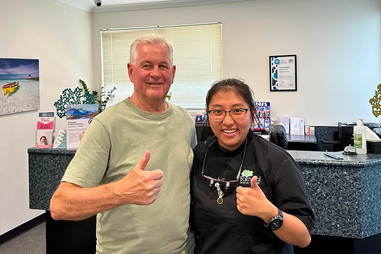 Dr Han posing with a smiling patient